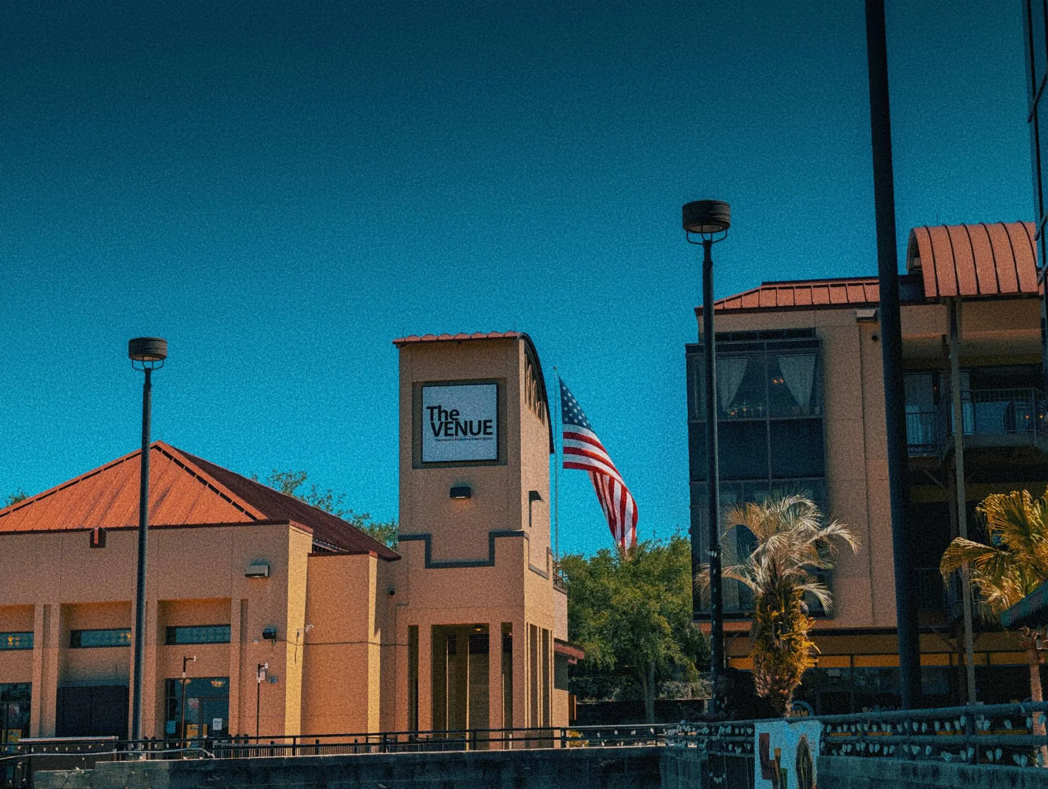 Exterior of The Venue Clermont building with American flag flying